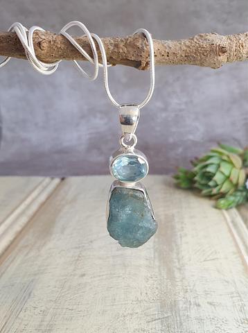 Hand crafted sterling silver blue topaz and aquamarine pendant.